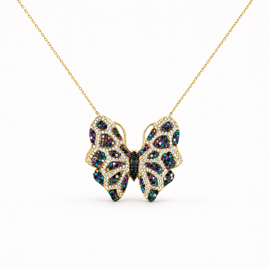 Gold-tone butterfly necklace with multicolor CZ accents on a delicate chain.