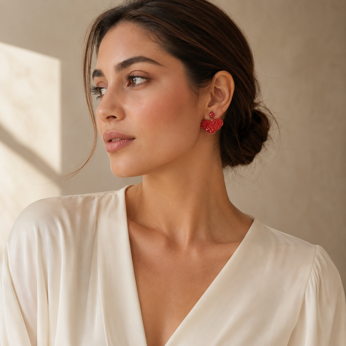 Red crystal heart stud earrings with a gold-plated finish in a clean product image.