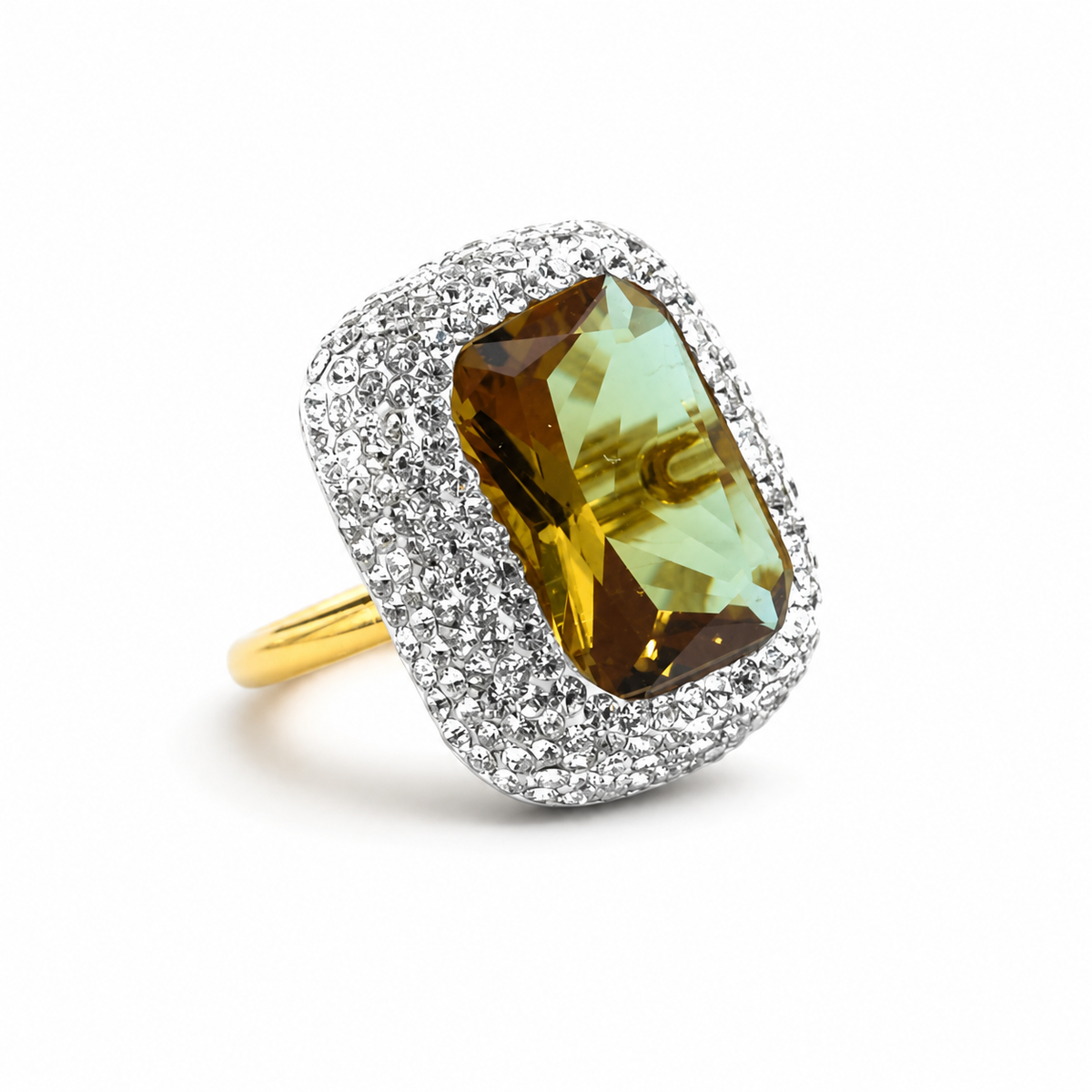 Rectangular faceted center stone ring with a sparkling halo and gold-tone band.