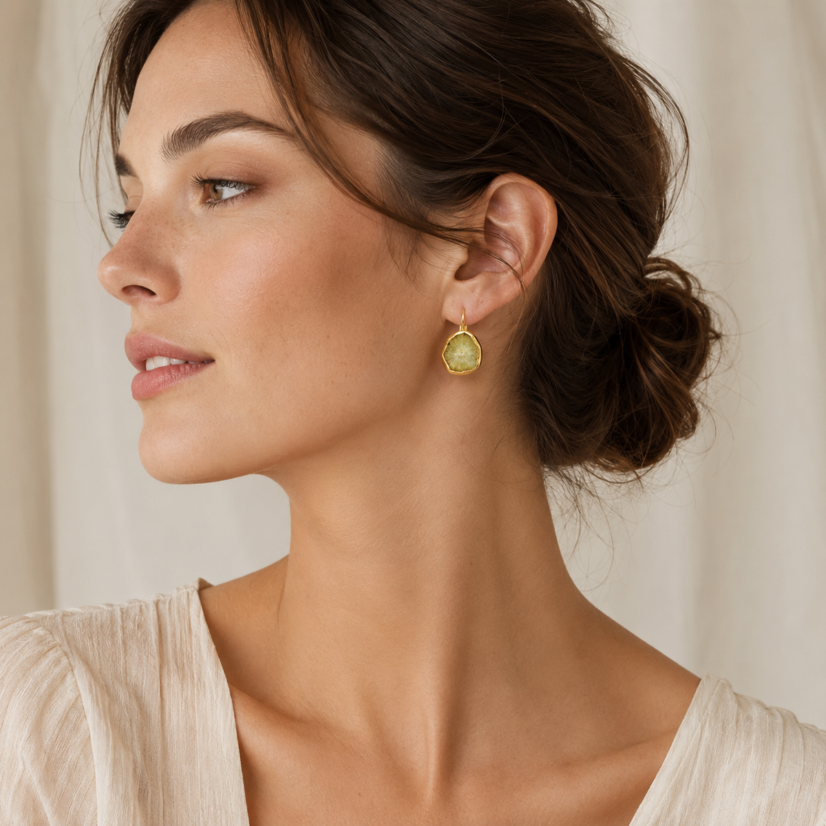 Raw garnet drop hoop earrings in a warm gold-plated finish.