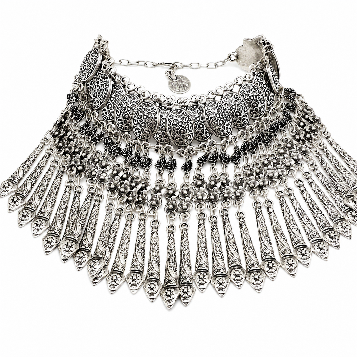 Silver-tone boho necklace with coin fringe and layered textured details.
