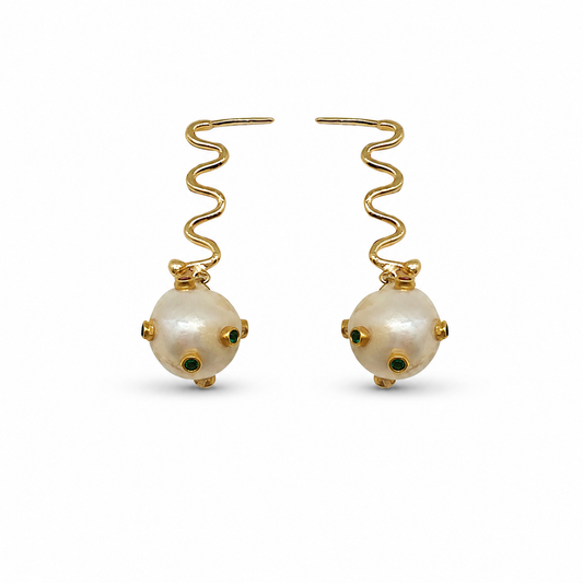 Pair of gold-plated drop earrings with wavy hooks and pearl-like spheres with green accents.