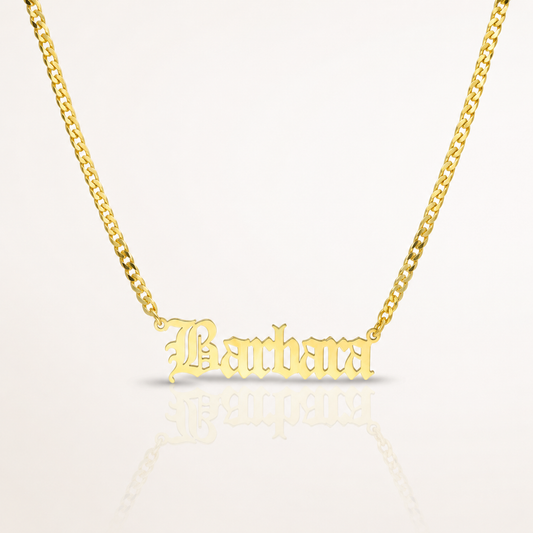 Gold-tone personalized name necklace with a polished chain and engraved name pendant.