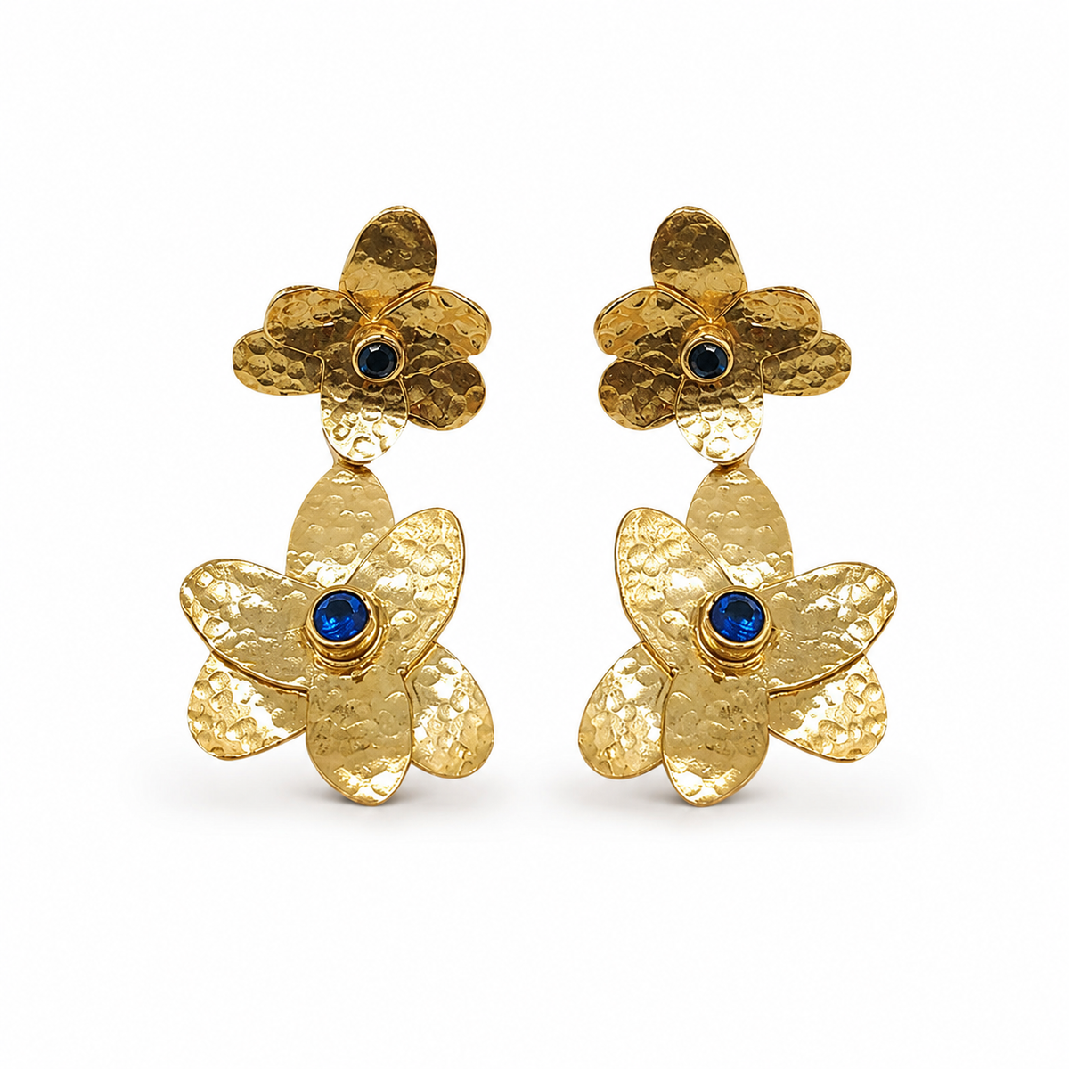 Gold-plated double flower drop earrings with blue stone centers on a white background.