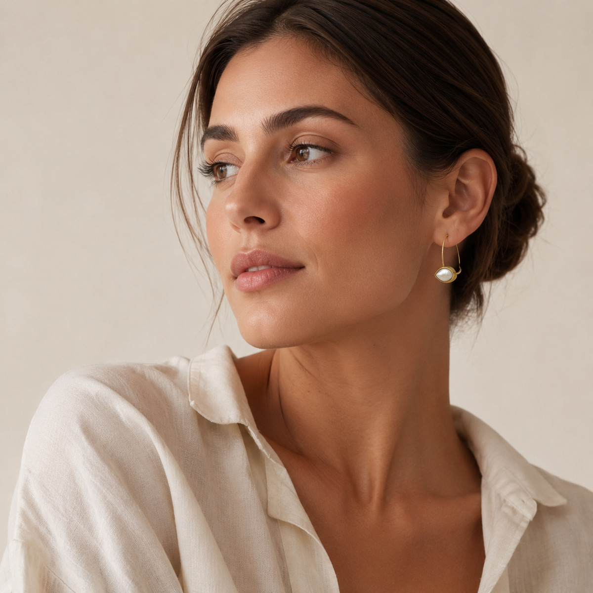 Pair of teardrop earrings with a polished gold-plated finish.