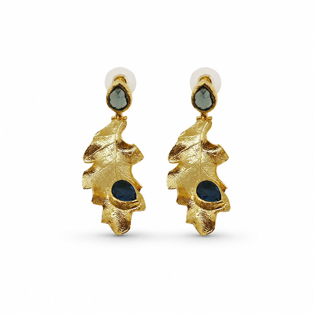 Gold leaf drop earrings with deep blue stone accents.