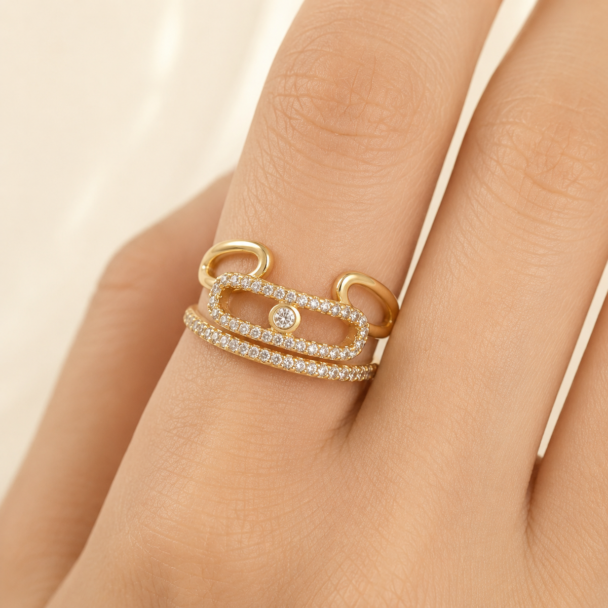 Gold-tone triple band wrap ring with sparkling CZ details.