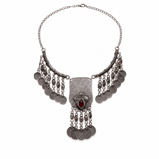 Silver-tone statement necklace with coin fringe and a red center stone.