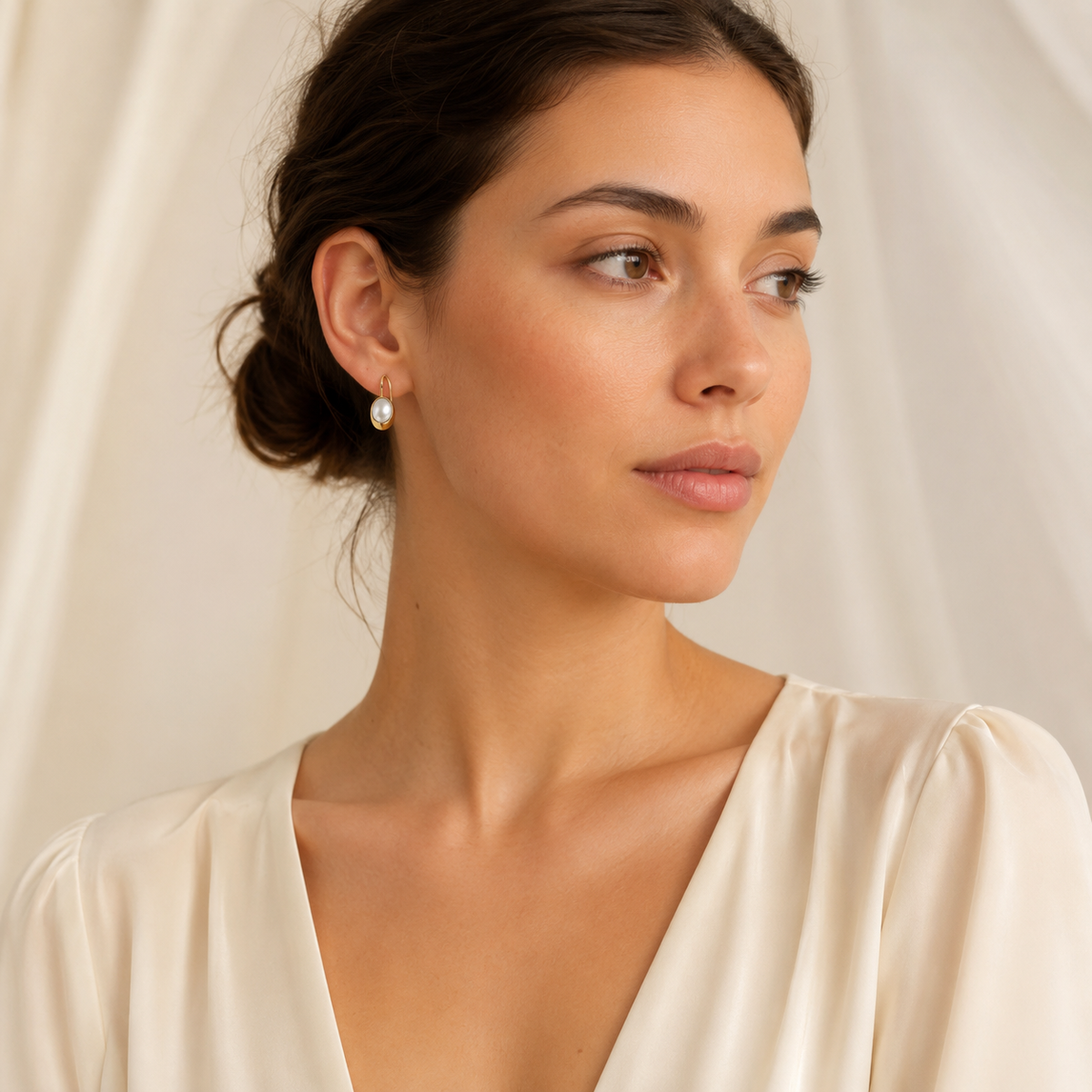Mother of pearl square drop earrings with a polished gold-plated look.