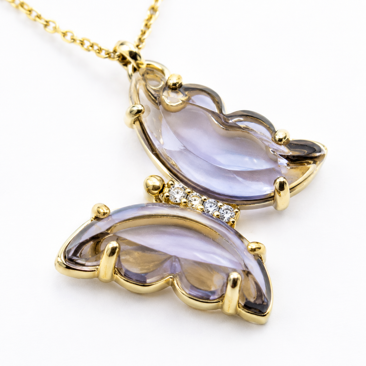 Close view of the purple butterfly pendant with gold-tone detailing