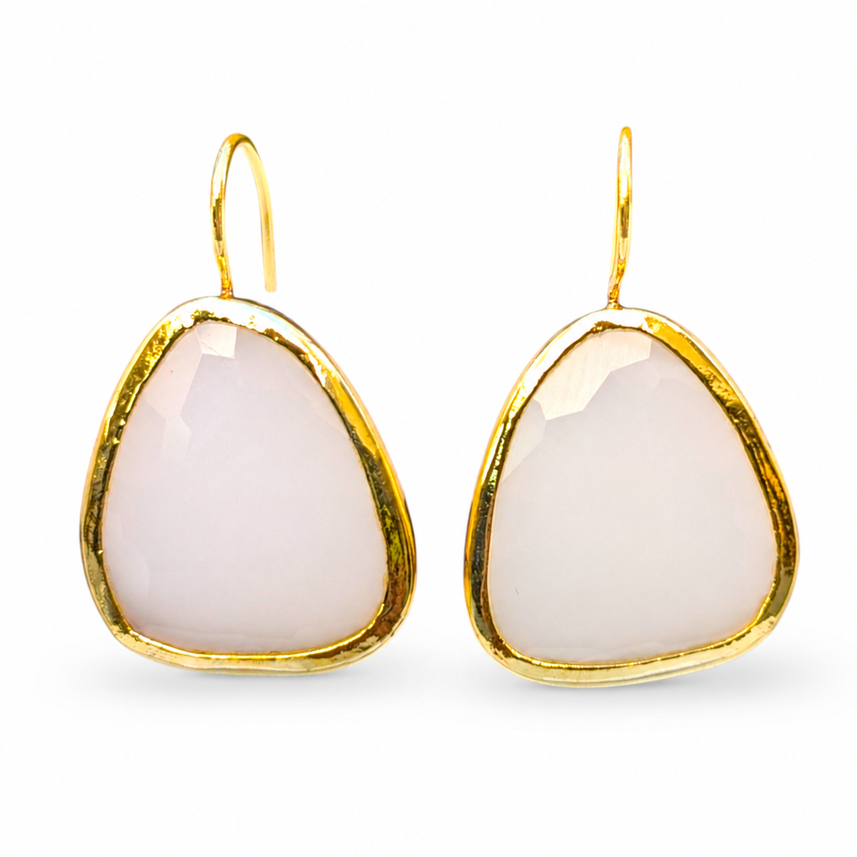 White chalcedony drop earrings with a polished gold-plated frame on a white background.