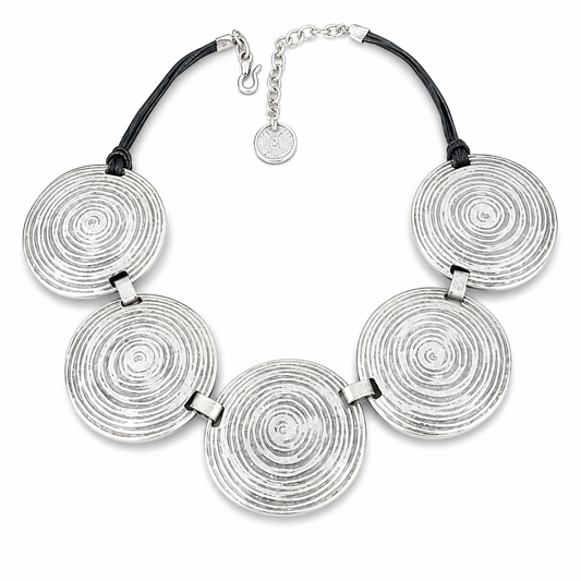 Silver necklace with five spiral disc pendants and a black cord-style chain.