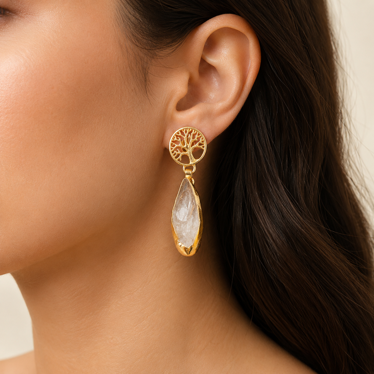 Gold-tone tree of life drop earrings shown front view.