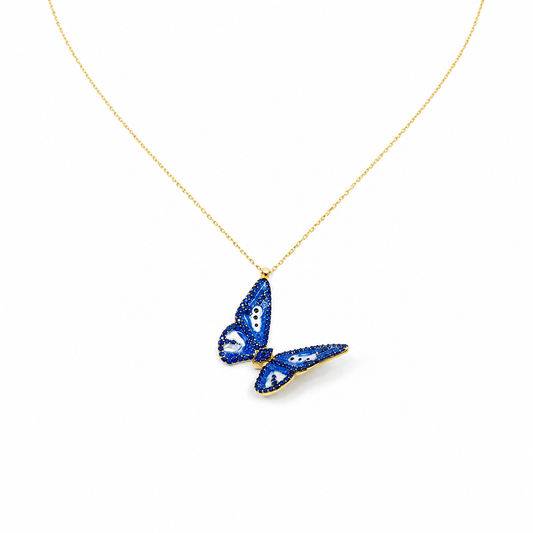 Gold-tone necklace with a navy enamel butterfly pendant.