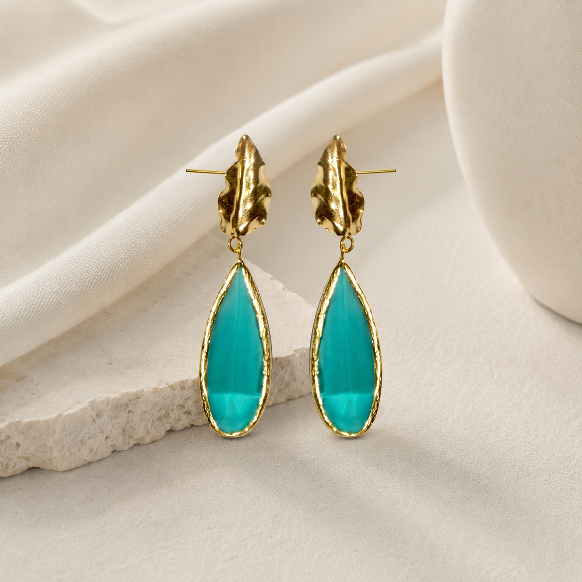Gold-plated leaf drop earrings with pine green teardrop accents.