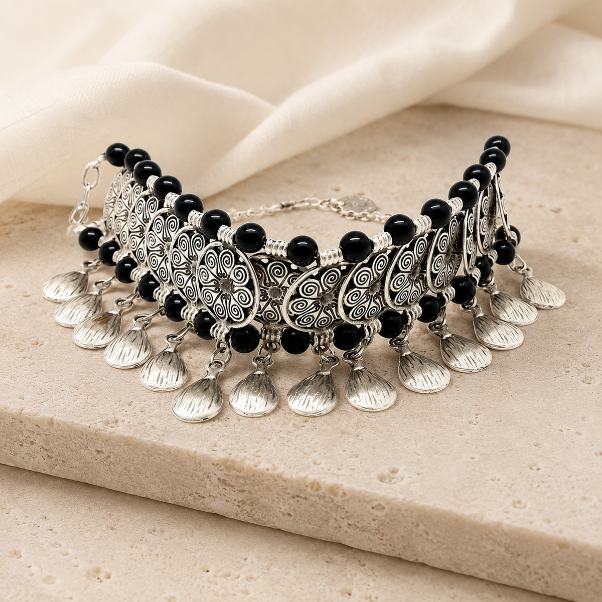 Black boho collar necklace with layered fan charms.