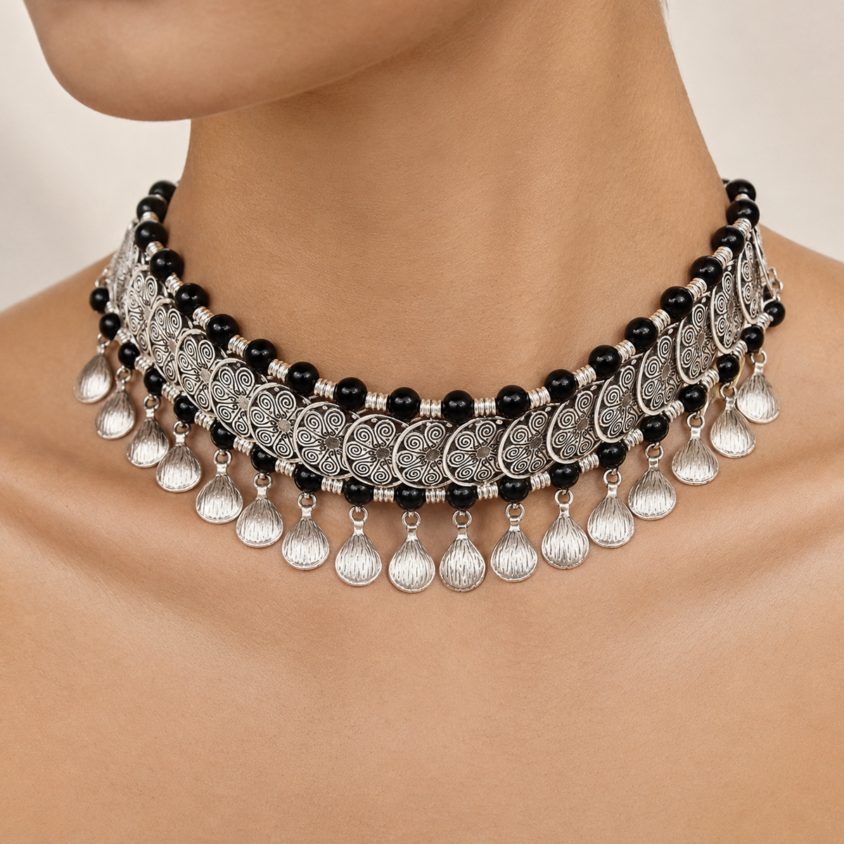 Black bead collar necklace shown from a front angle.