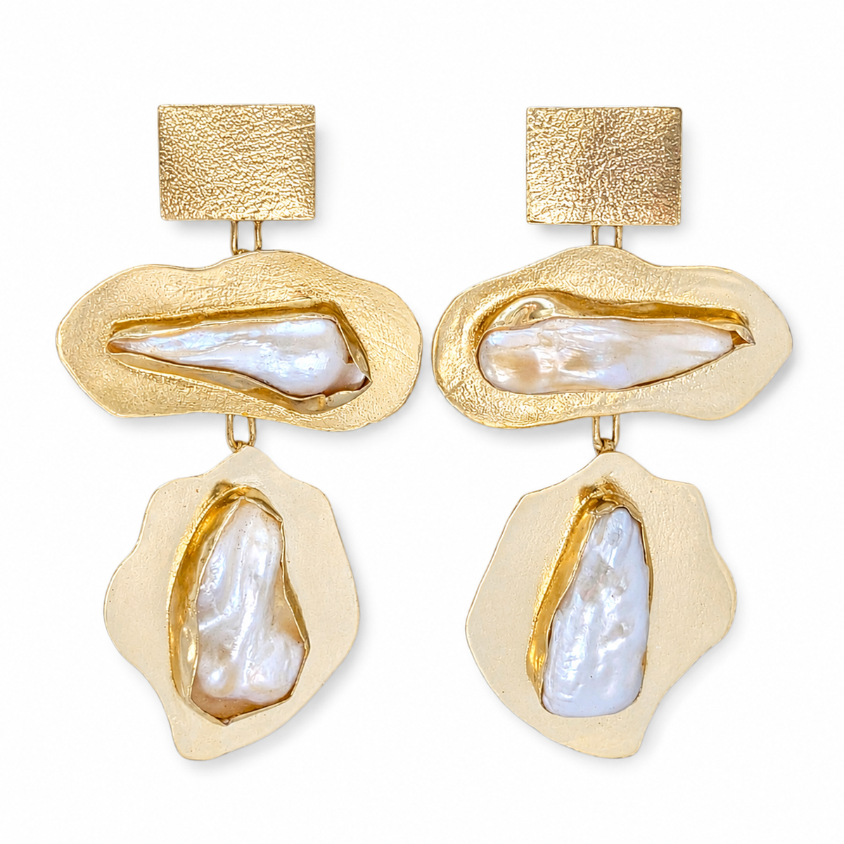 Baroque pearl statement earrings with sculptural gold-plated shapes and a textured finish.