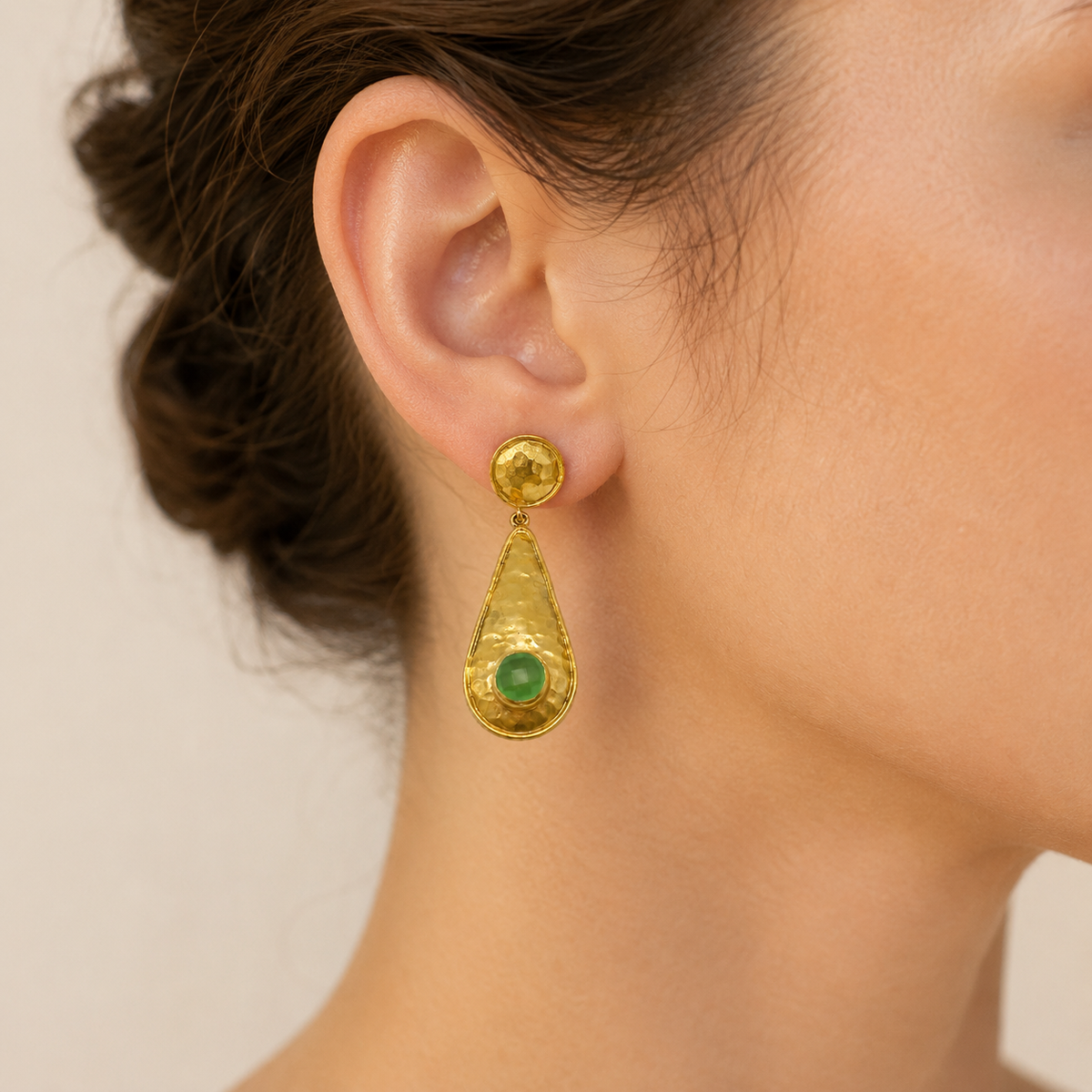 Gold-plated hammered drop earrings shown from the front.