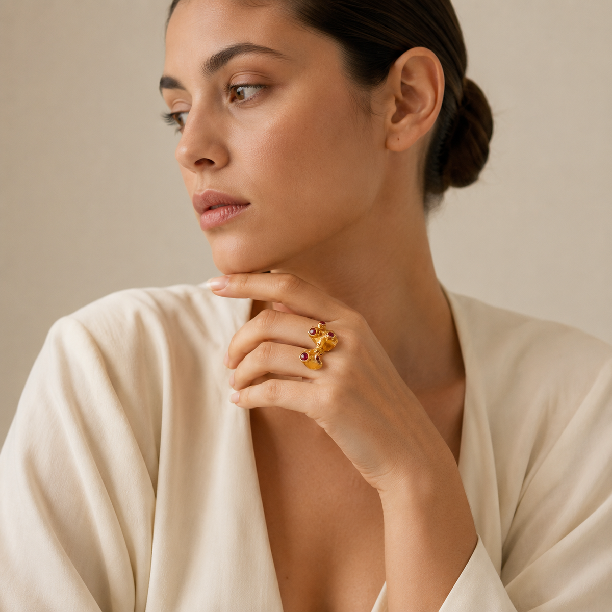 Ruby pink stone ring with a gold-plated open cuff design.