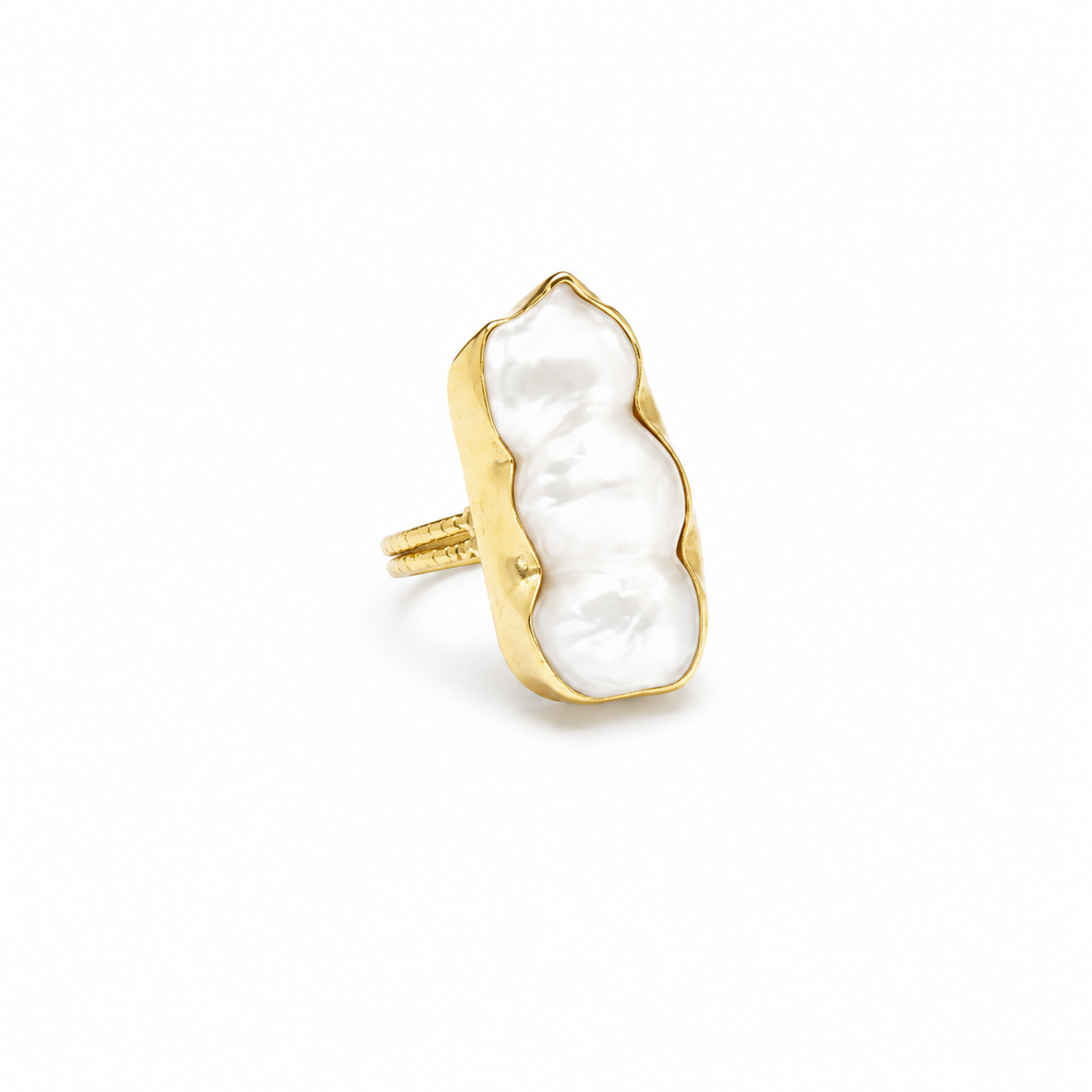 A baroque pearl statement ring with a gold-plated frame and sculptural silhouette.