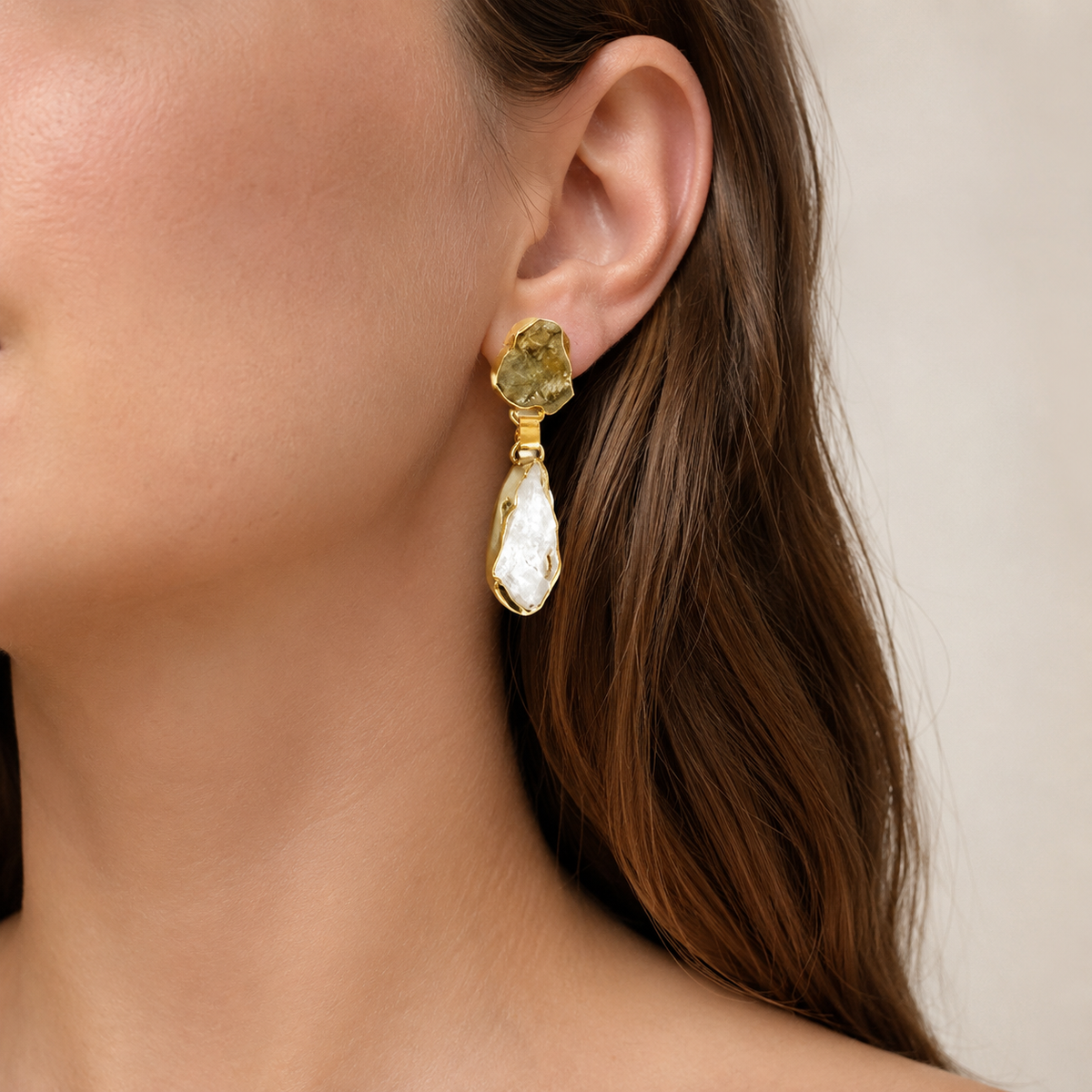 Gold-plated drop earrings with rough citrine and clear quartz stones, shown front view.
