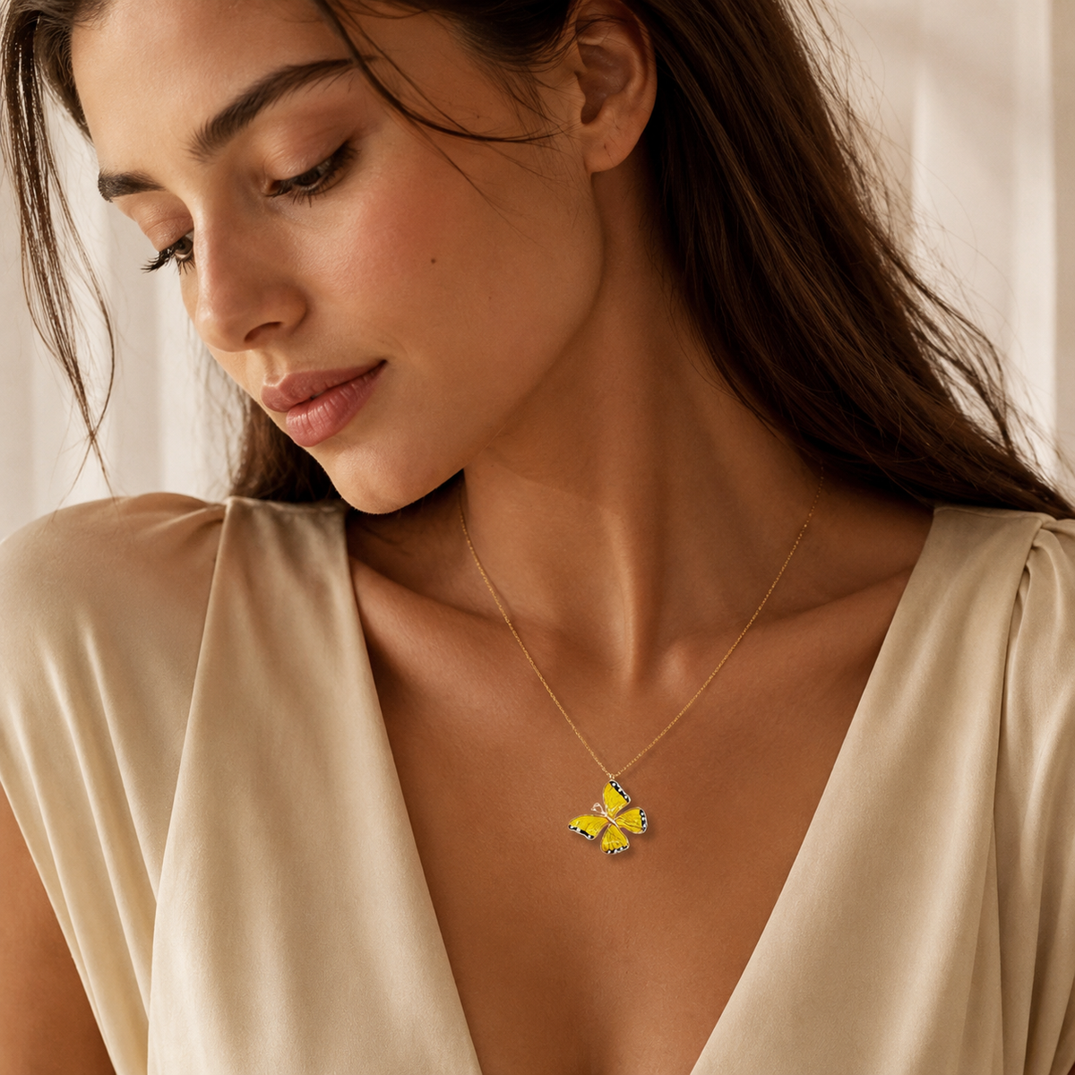 Gold-tone chain with a yellow butterfly charm.