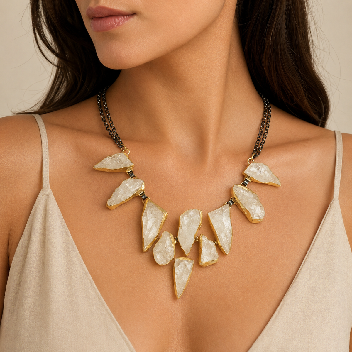 Rock crystal statement necklace shown from the front with layered black chain and gold-tone details.