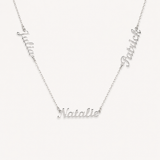 Silver-tone necklace with three engraved name charms on a fine chain.