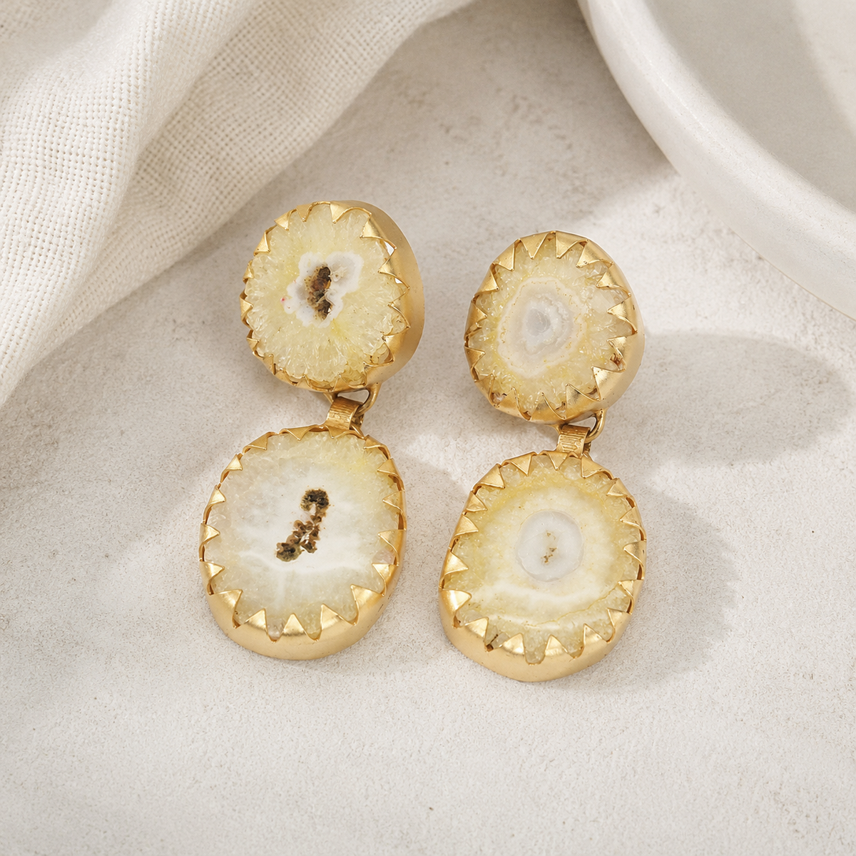 Yellow agate drop earrings with a soft golden tone and sculptural design.