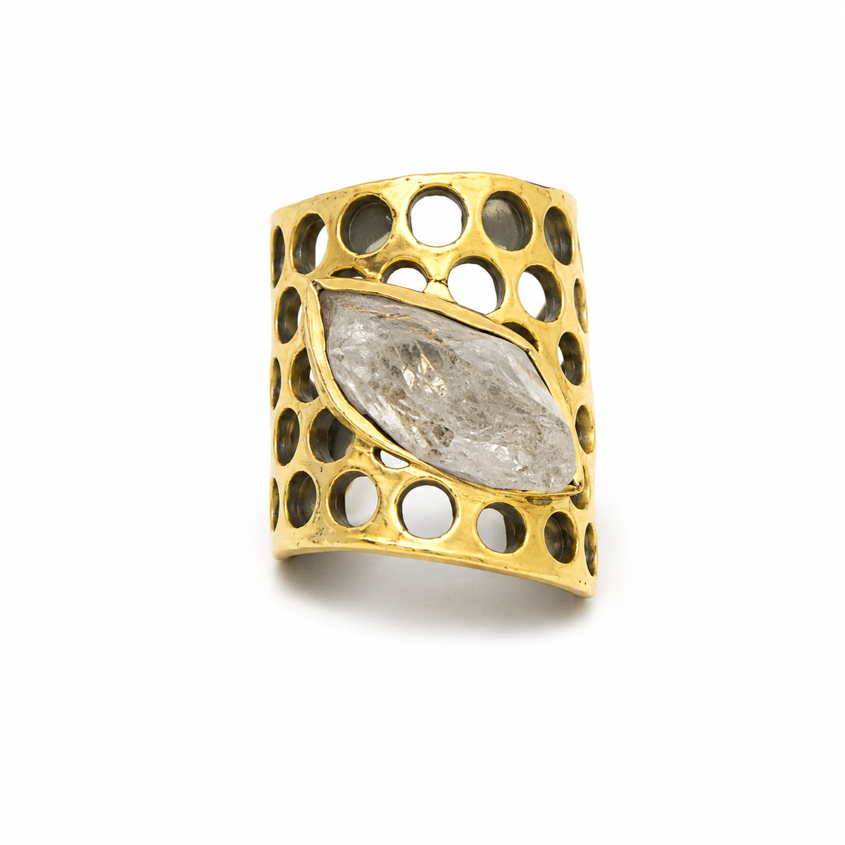 Gold-plated statement ring with a clear quartz center and honeycomb-inspired openwork design.