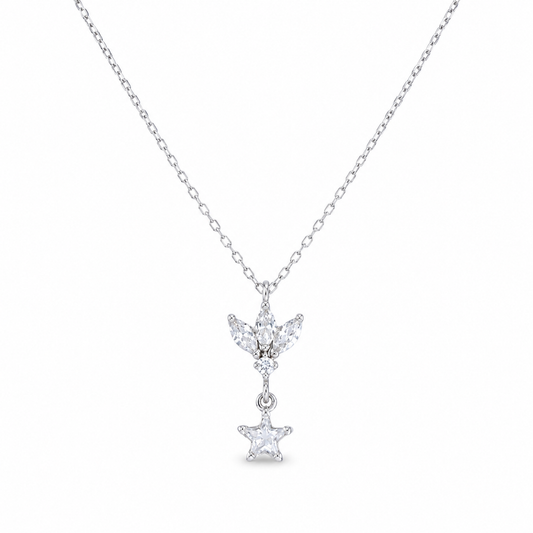 A silver-tone pendant necklace with a lotus-inspired charm and clear star drop.