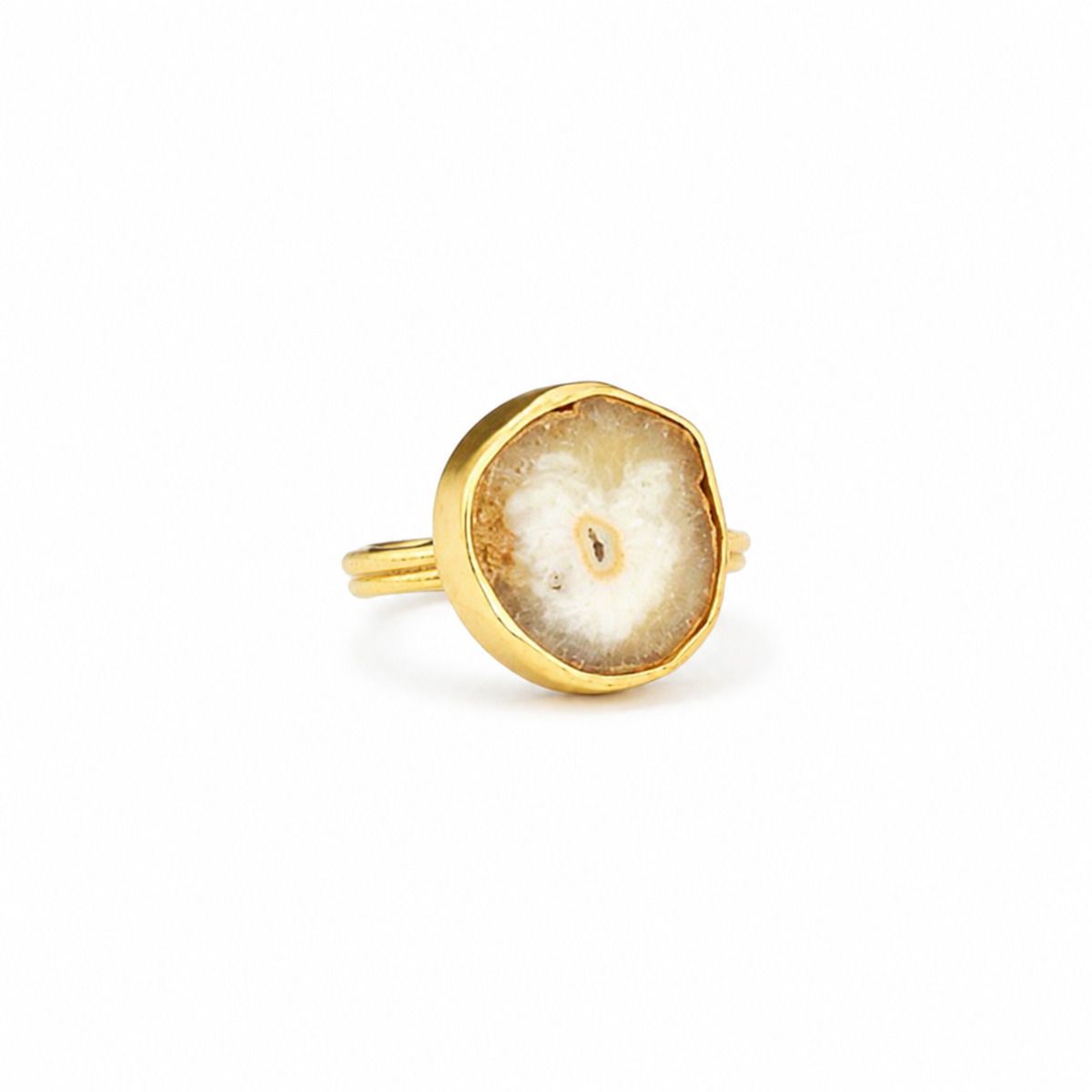 Gold-plated bezel ring with a solar quartz slice center on a white background.