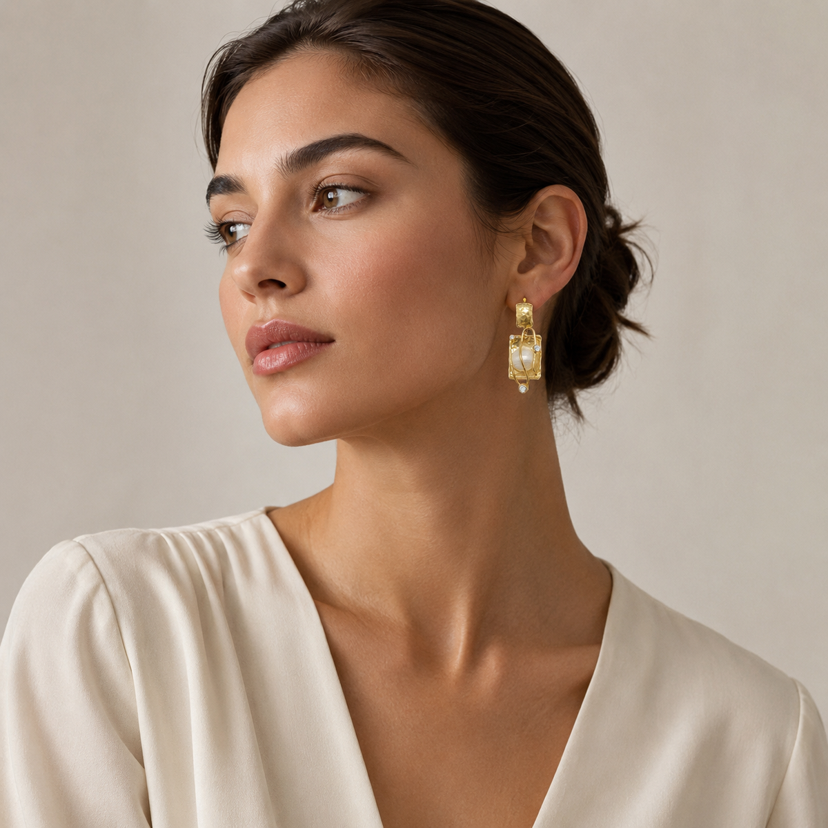 Pair of sculptural pearl and gold-plated drop earrings.