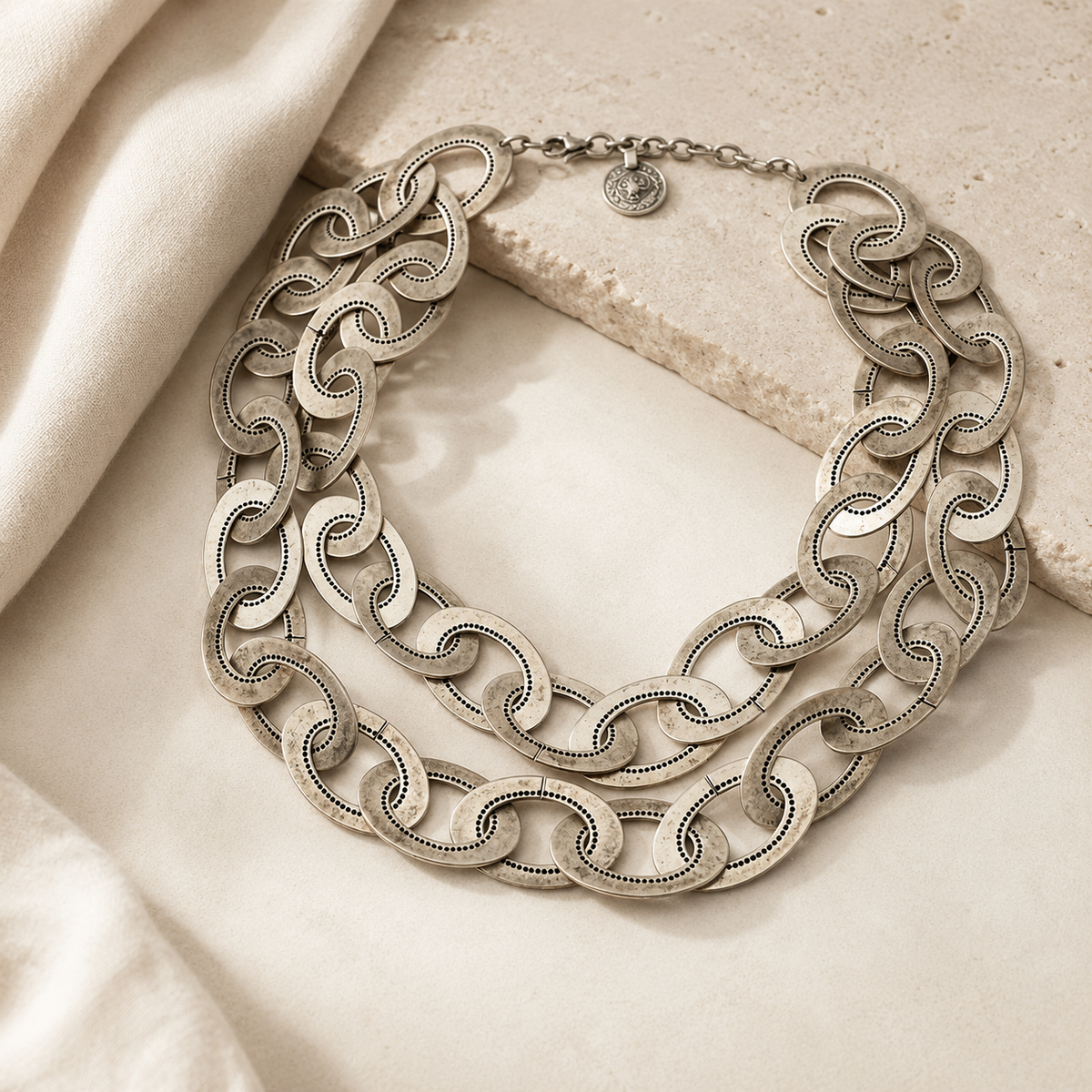 Oversized silver-tone chain link necklace with layered links.