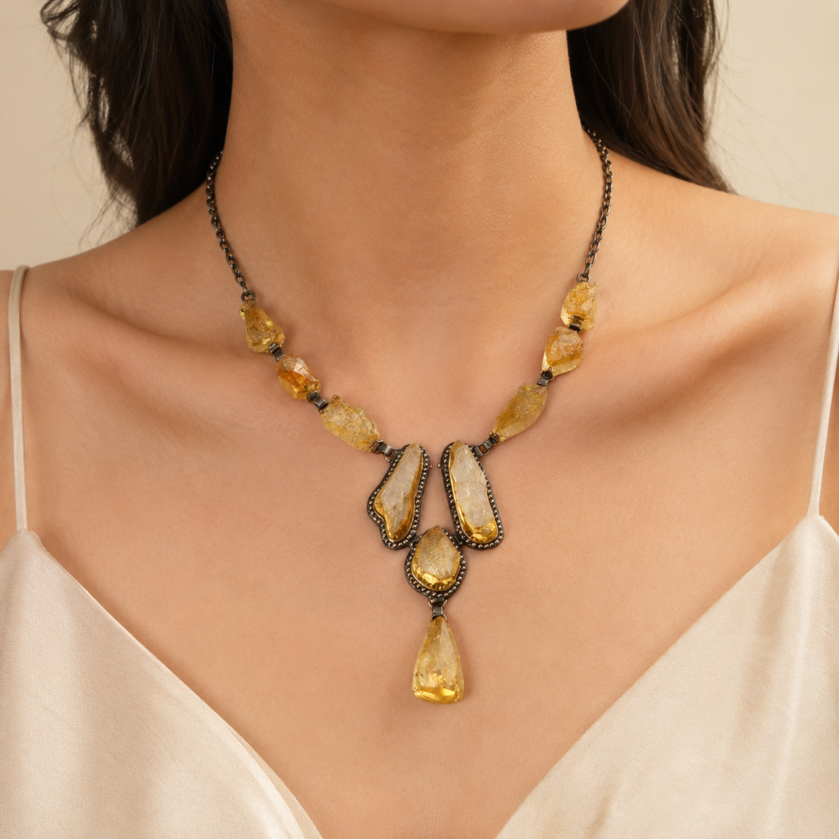 Raw citrine statement necklace shown on a white background.