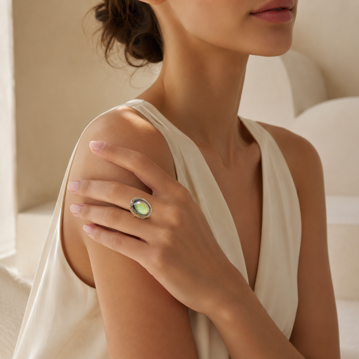Gold-plated ring with a faceted mood stone-style center and detailed CZ halo.