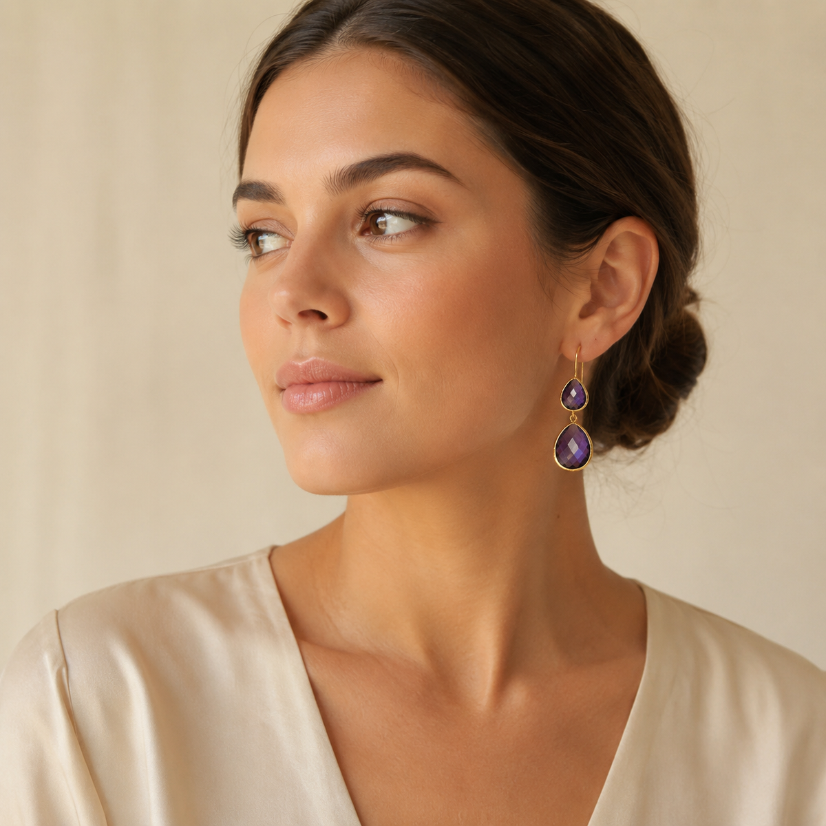 Gold-plated drop earrings with faceted amethyst stones.