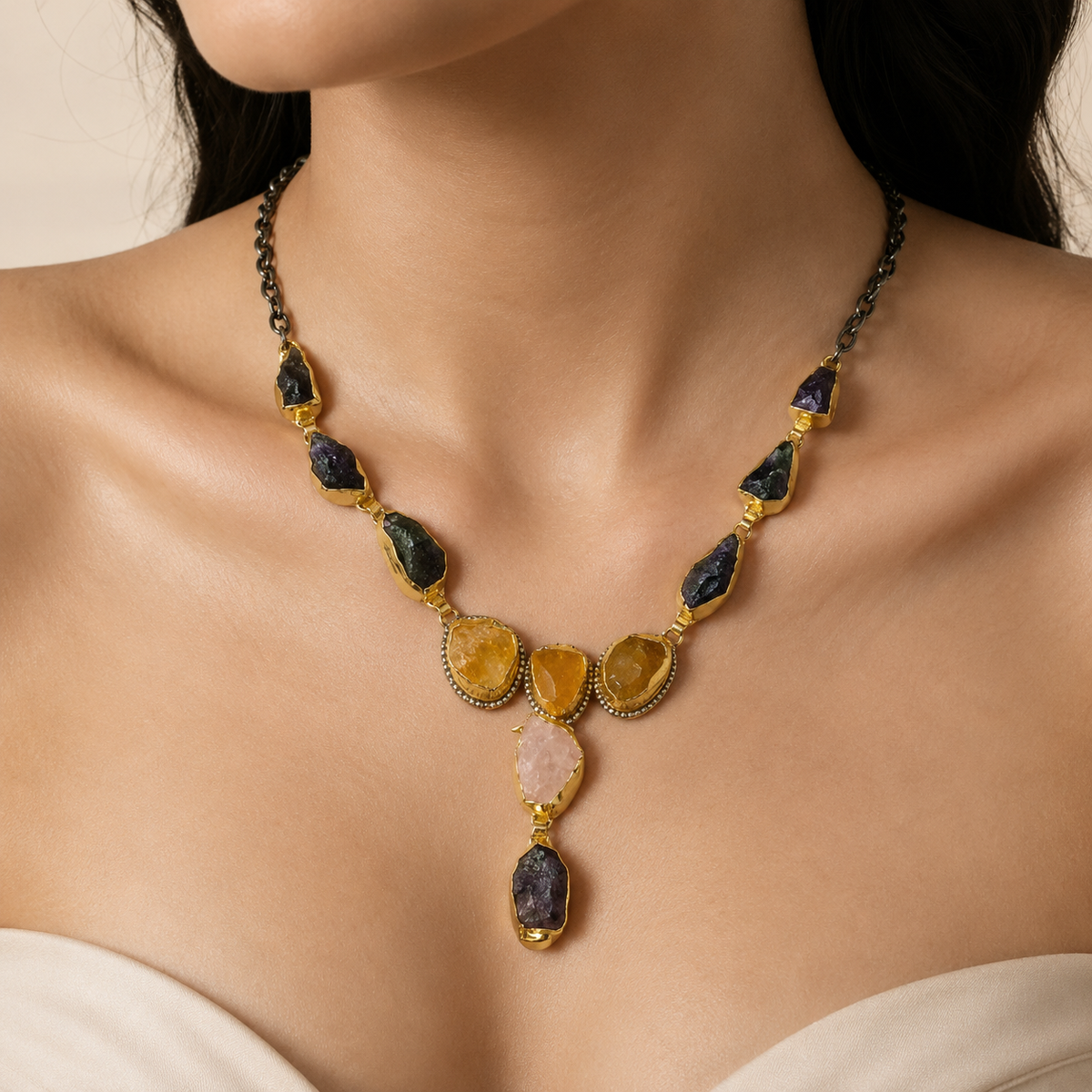 Mixed gemstone Y drop necklace shown on a model with a gold-tone finish.