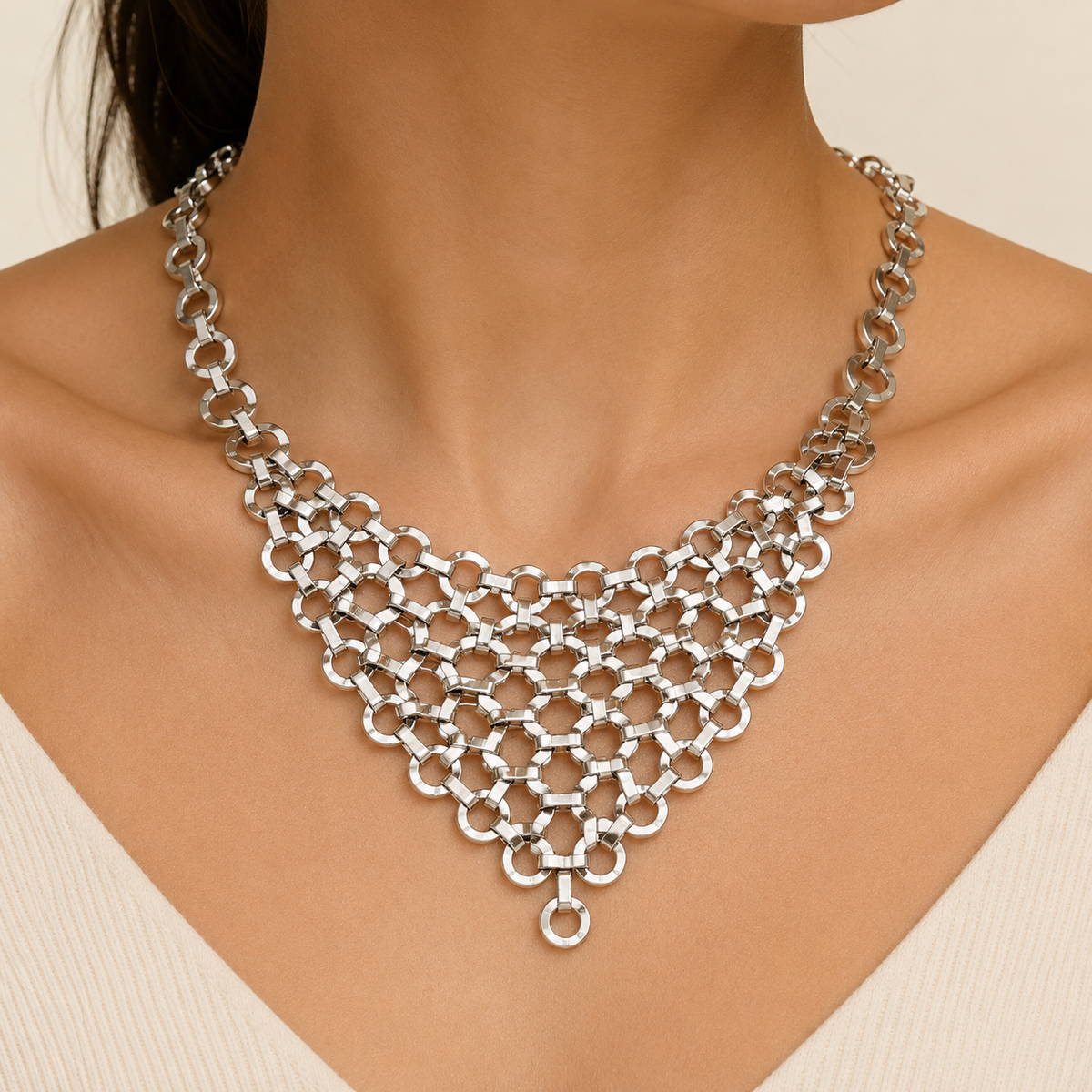 Silver-tone mesh bib statement necklace shown on a white background.