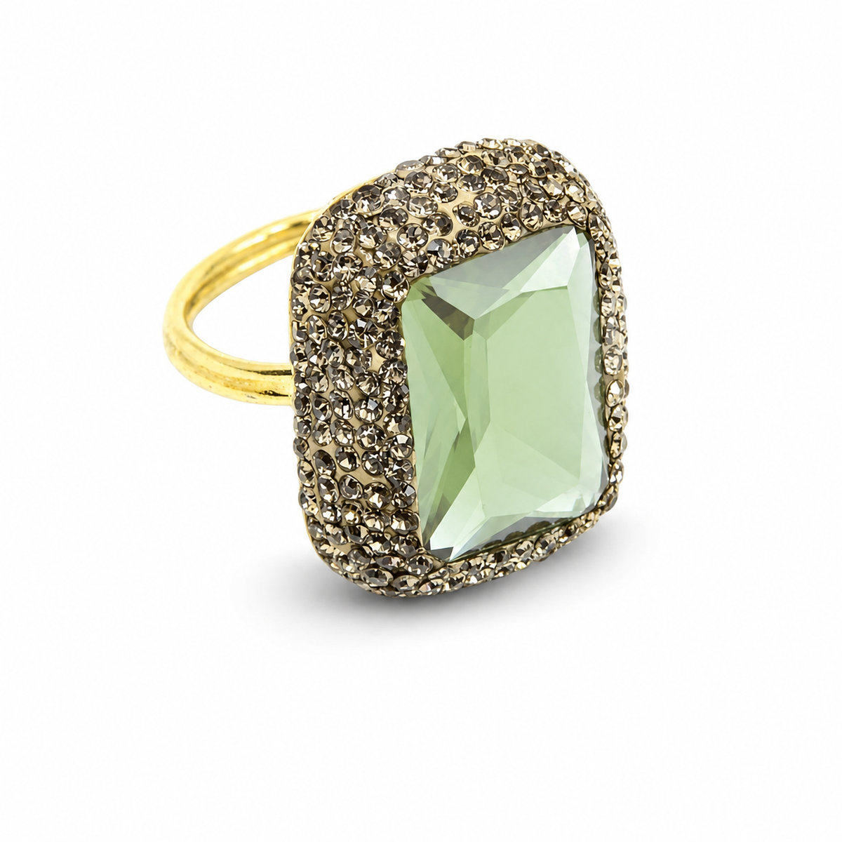 A gold-tone ring with a faceted color-changing stone and textured setting.