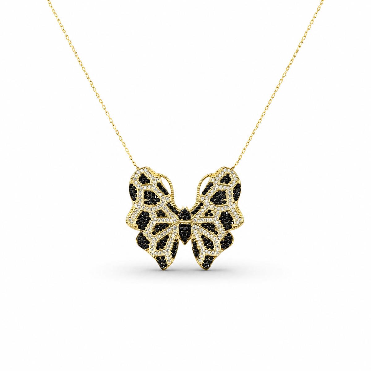 Gold-tone butterfly necklace with black CZ detailing on a delicate chain.