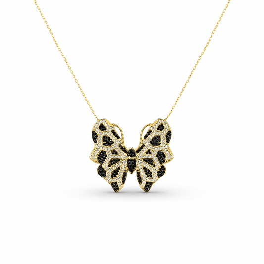 Gold-tone butterfly necklace with black CZ detailing on a delicate chain.