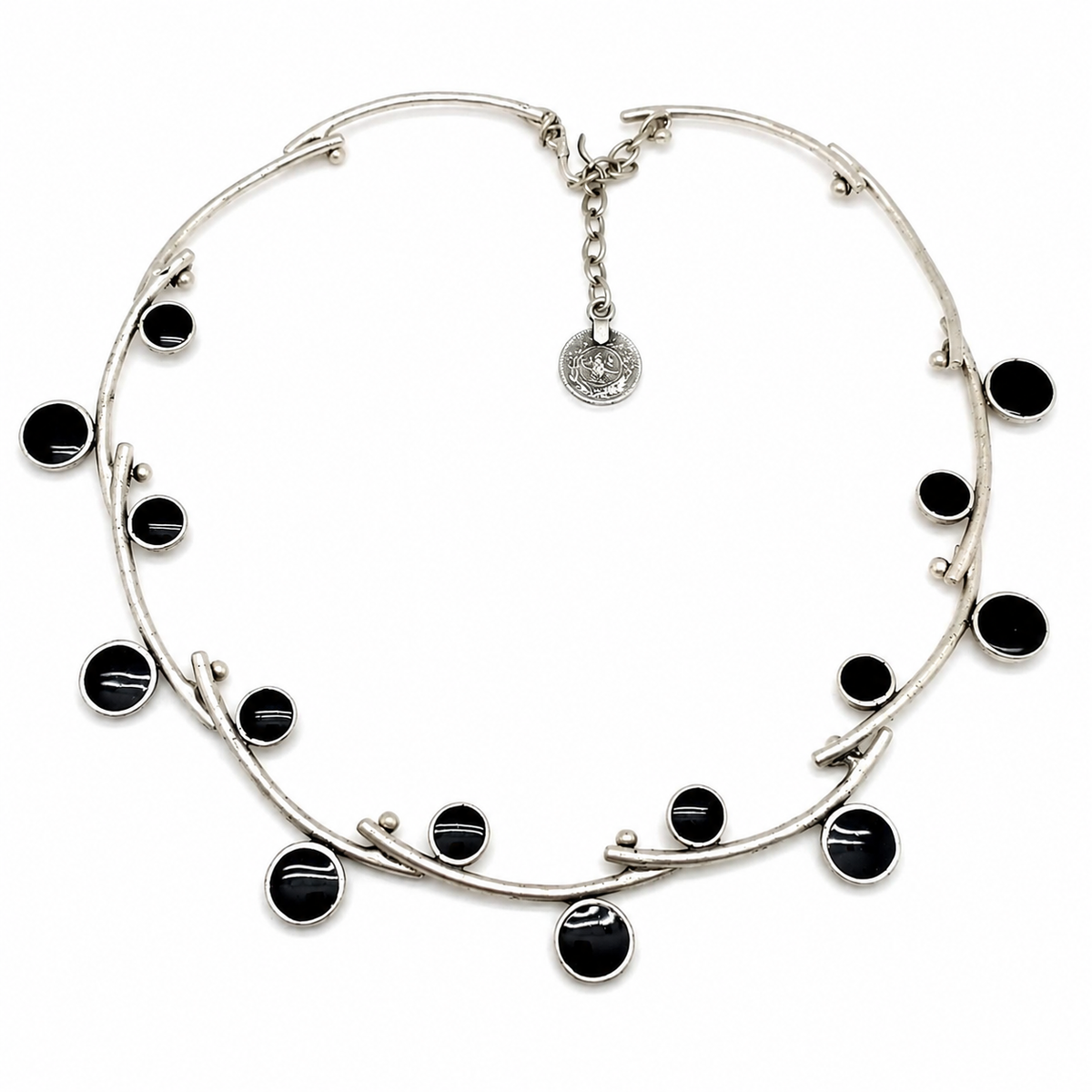Silver-tone open wire collar necklace with glossy black stone accents.