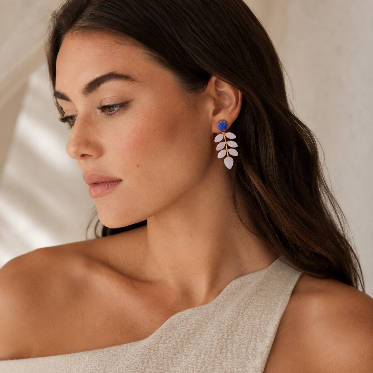 Matching pair of statement earrings with blue druzy and mother of pearl leaf drops.