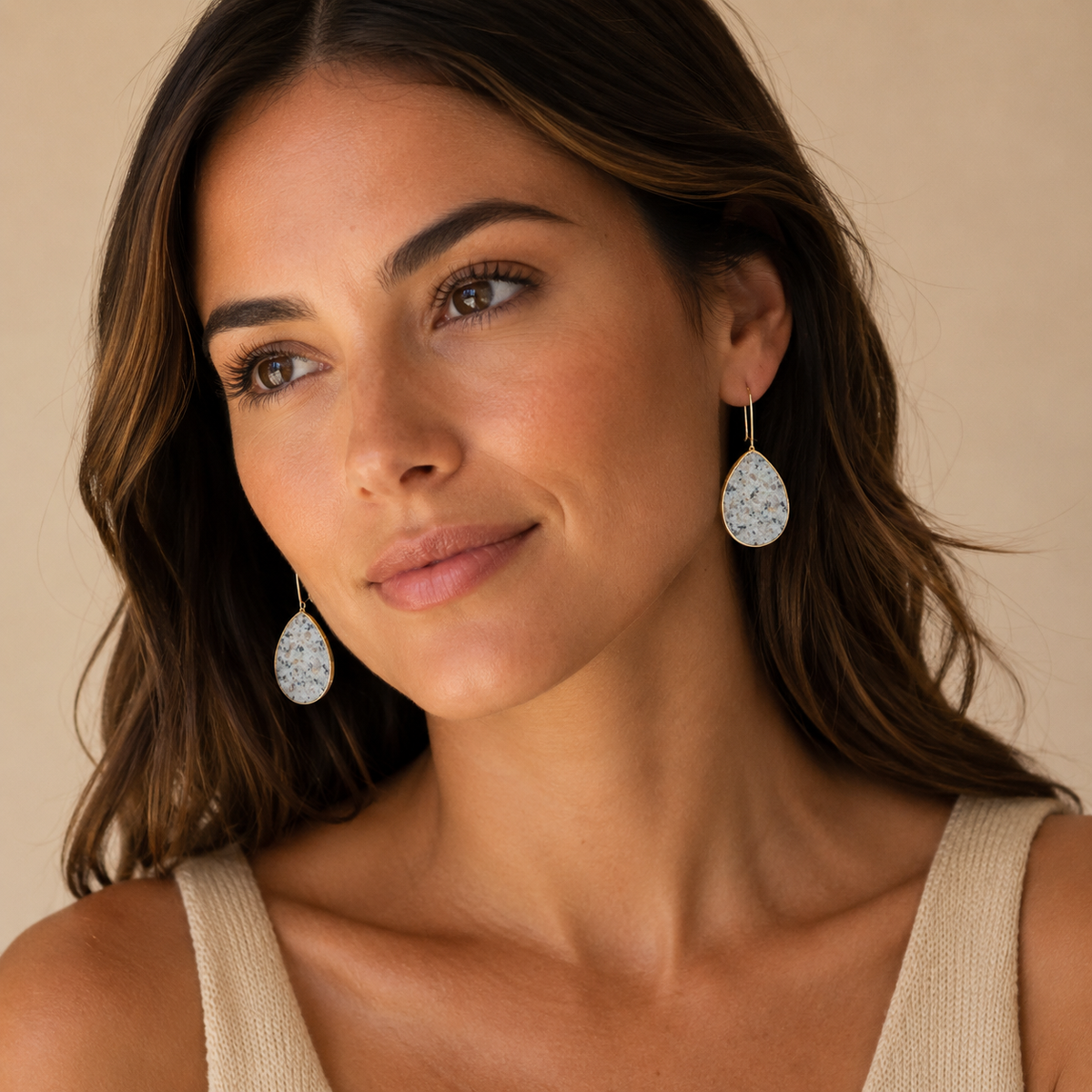 Amazonite drop earrings with a polished gold-plated outline.
