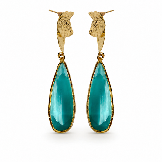 Gold-plated drop earrings with turquoise teardrop stones and sculpted tops.
