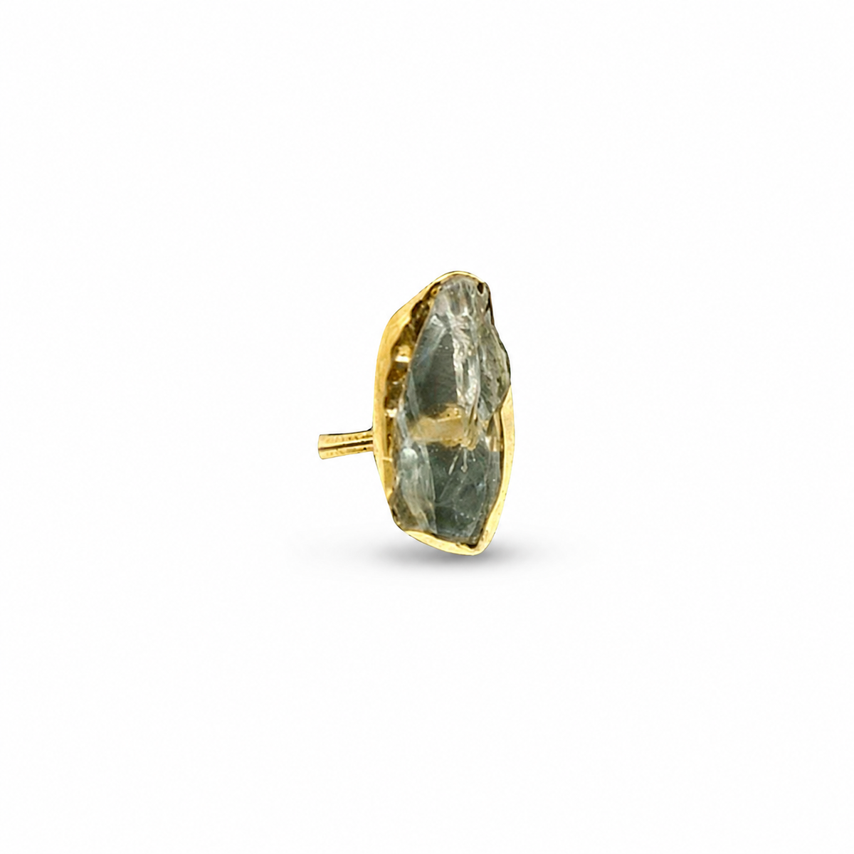 Raw green amethyst statement ring with a gold-plated setting on a white background.