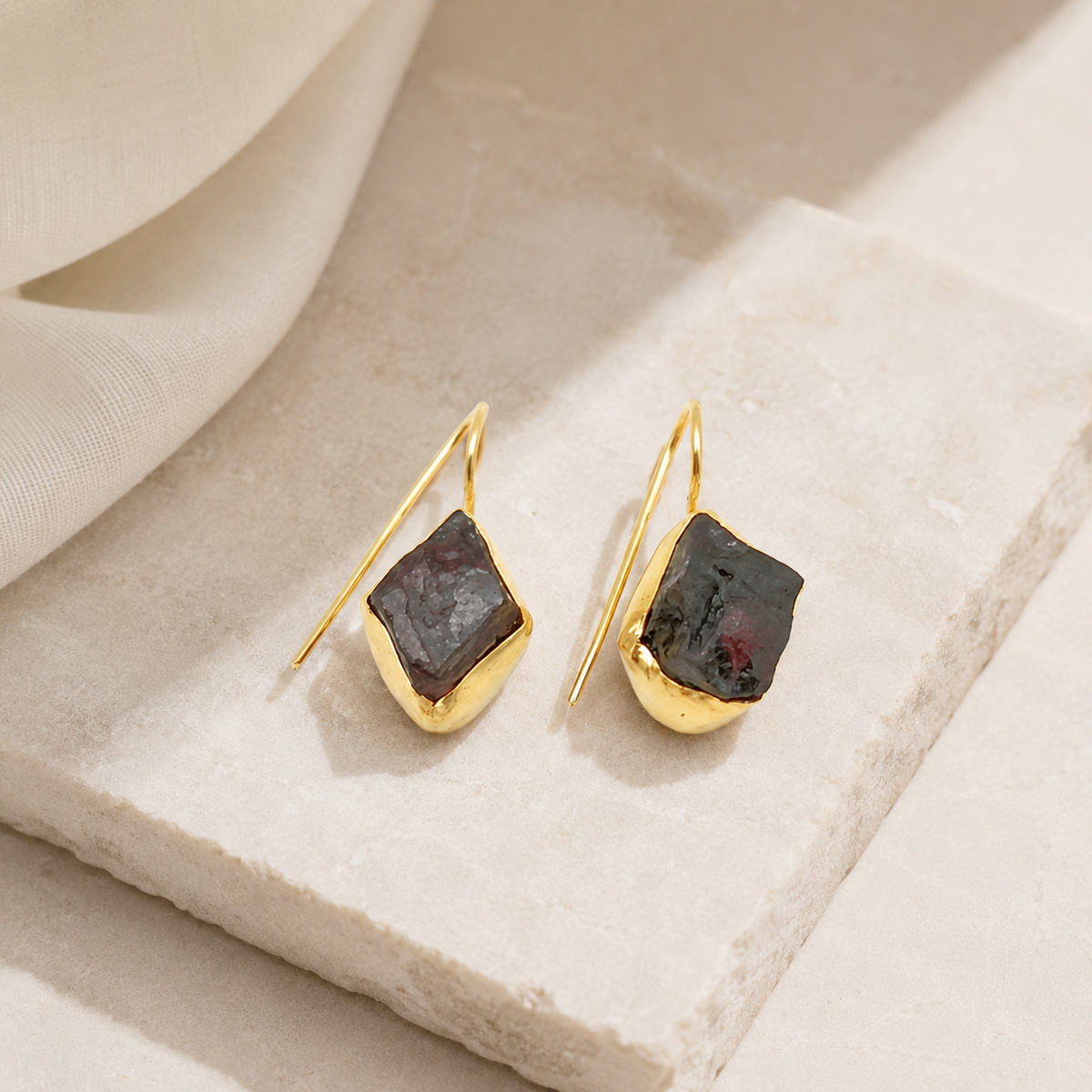 Gold-plated drop earrings with green agate slice stones styled as a statement pair.