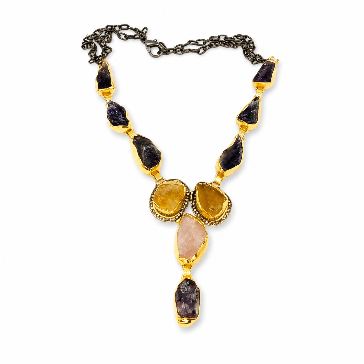 Mixed gemstone Y drop necklace with gold-tone settings and dark, pink, and amber stones.
